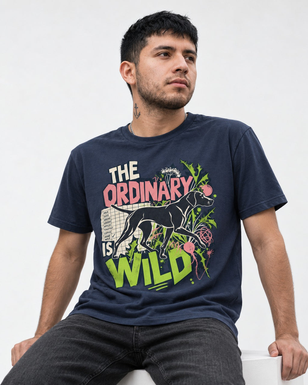 German Shorthaired Pointer The Ordinary Is Wild Grocery List Graphic T-Shirt in Navy, worn by a seated model