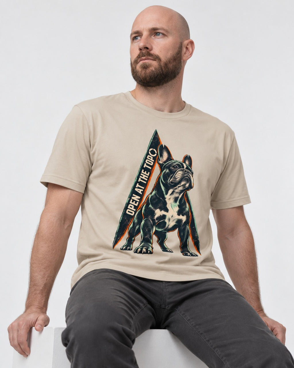 Frenchie Open at the Top T-Shirt in Sand, worn by a seated model