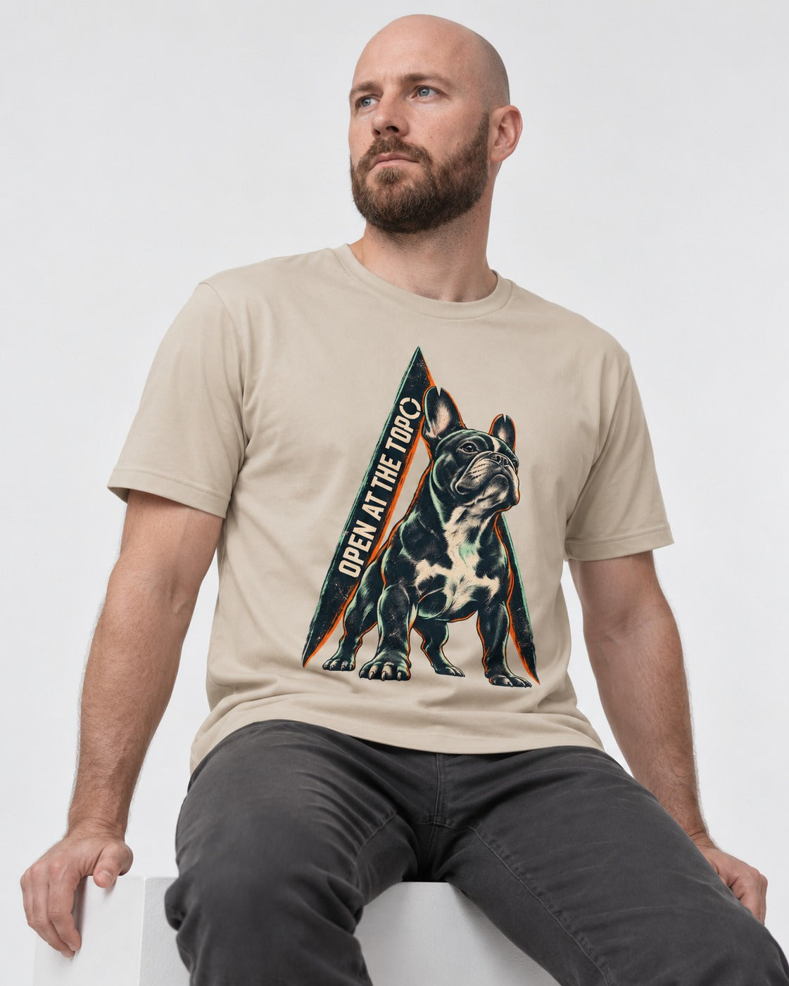 Frenchie Open at the Top T-Shirt in Sand, worn by a seated model
