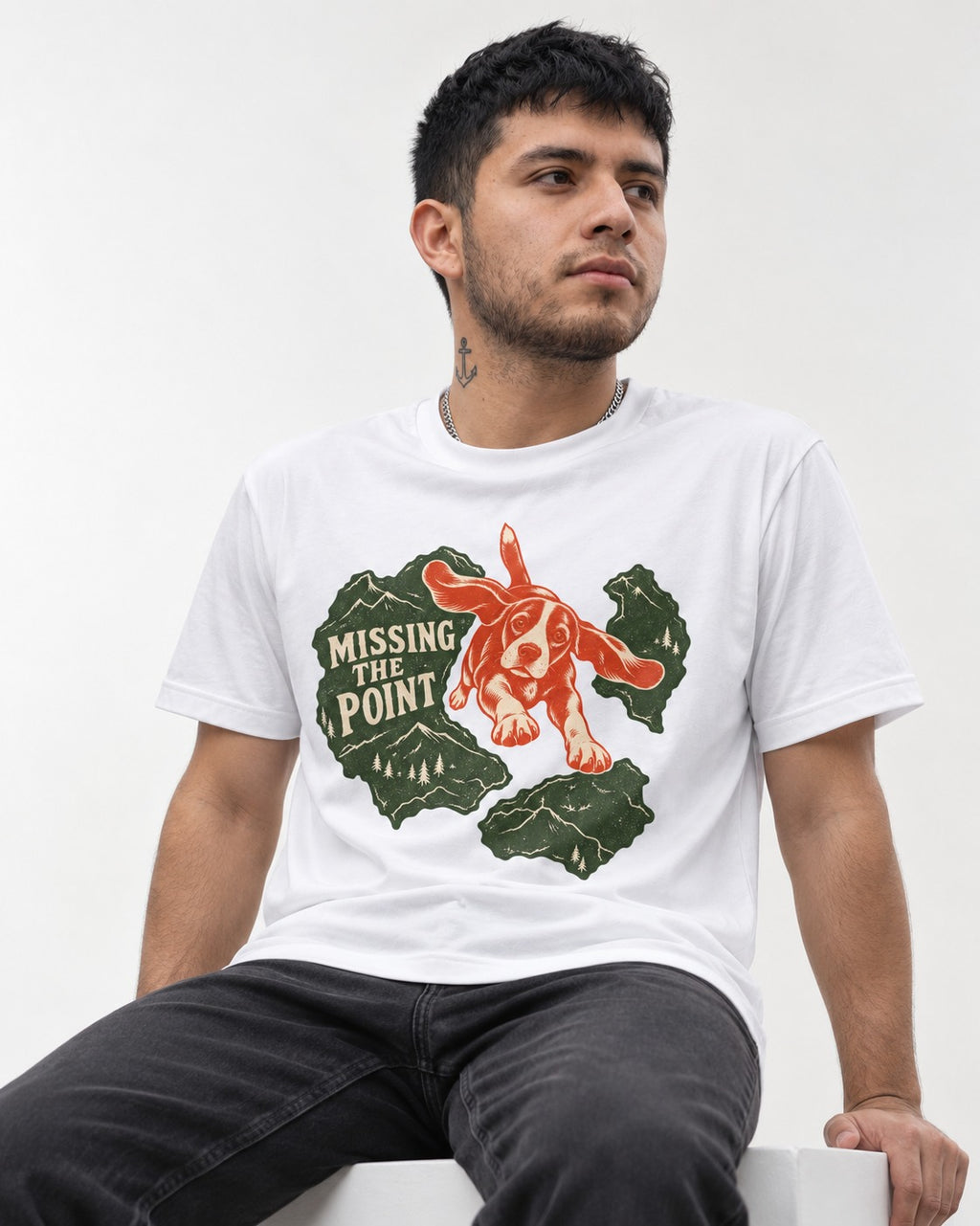 Missing The Point Beagle Trail T-Shirt in White, worn by a seated model