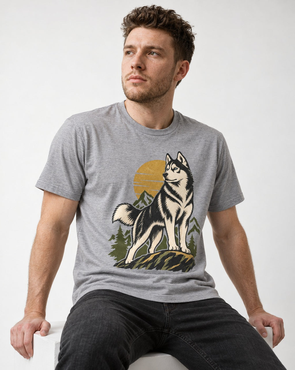 Husky Born to Roam T-Shirt in Sport Grey, worn by a seated model