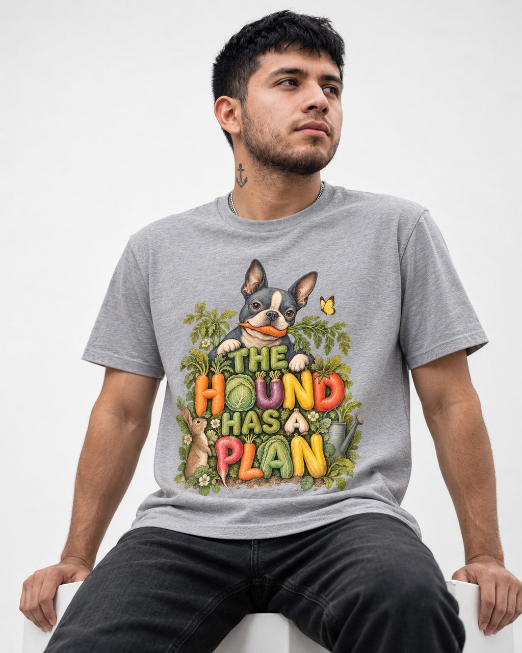 The Hound Has a Plan Boston Terrier T-Shirt in Sport Grey, worn by a seated model