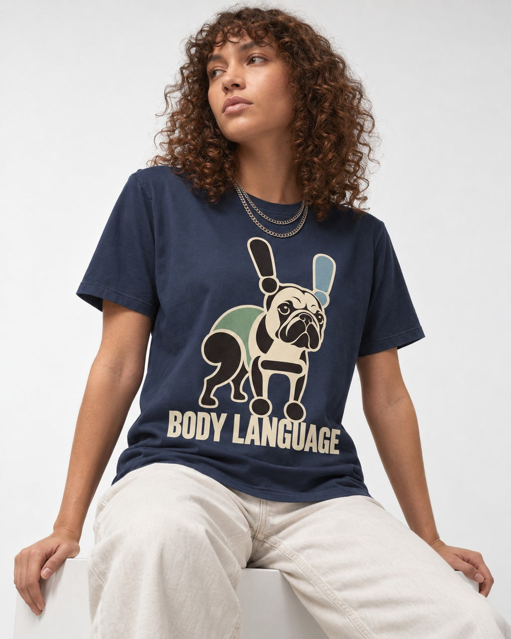 Frenchie Body Language Punctuation Graphic T-Shirt in Navy, worn by a seated model