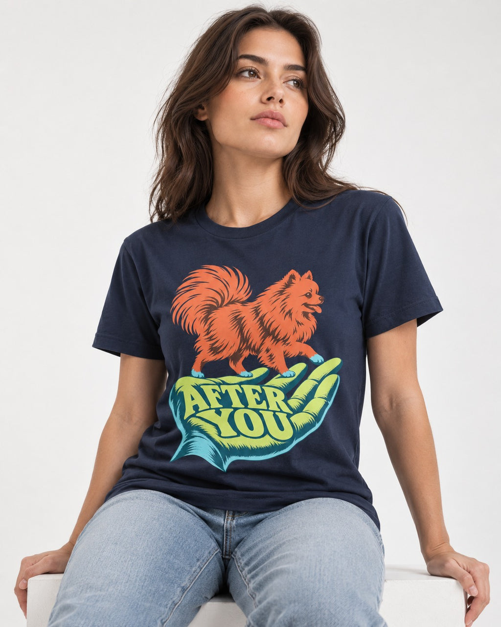Pomeranian After You Helping Hand Graphic T-Shirt in Navy, worn by a seated model