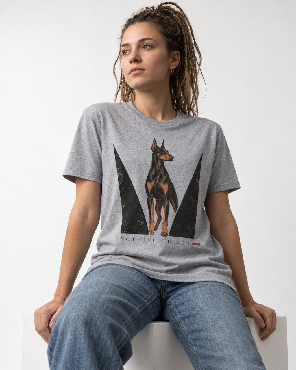 Doberman Nothing to Add T-Shirt in Sport Grey, worn by a seated model