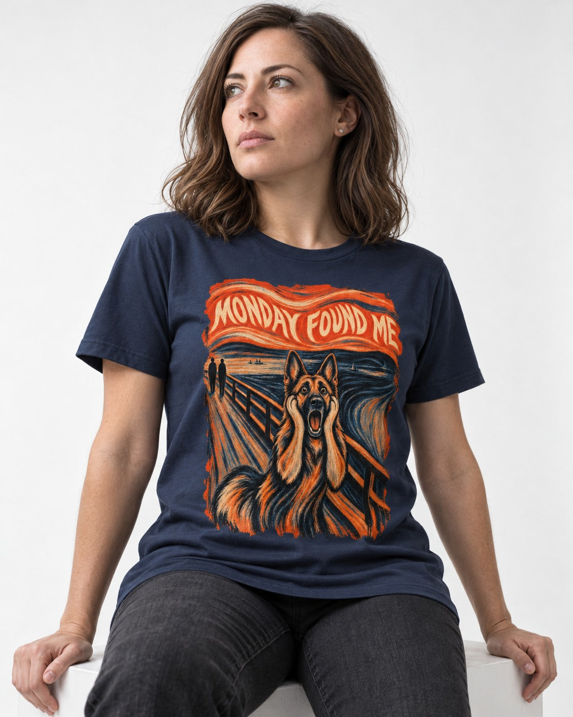 German Shepherd Dog Monday Found Me Scream Graphic T-Shirt in Navy, worn by a seated model