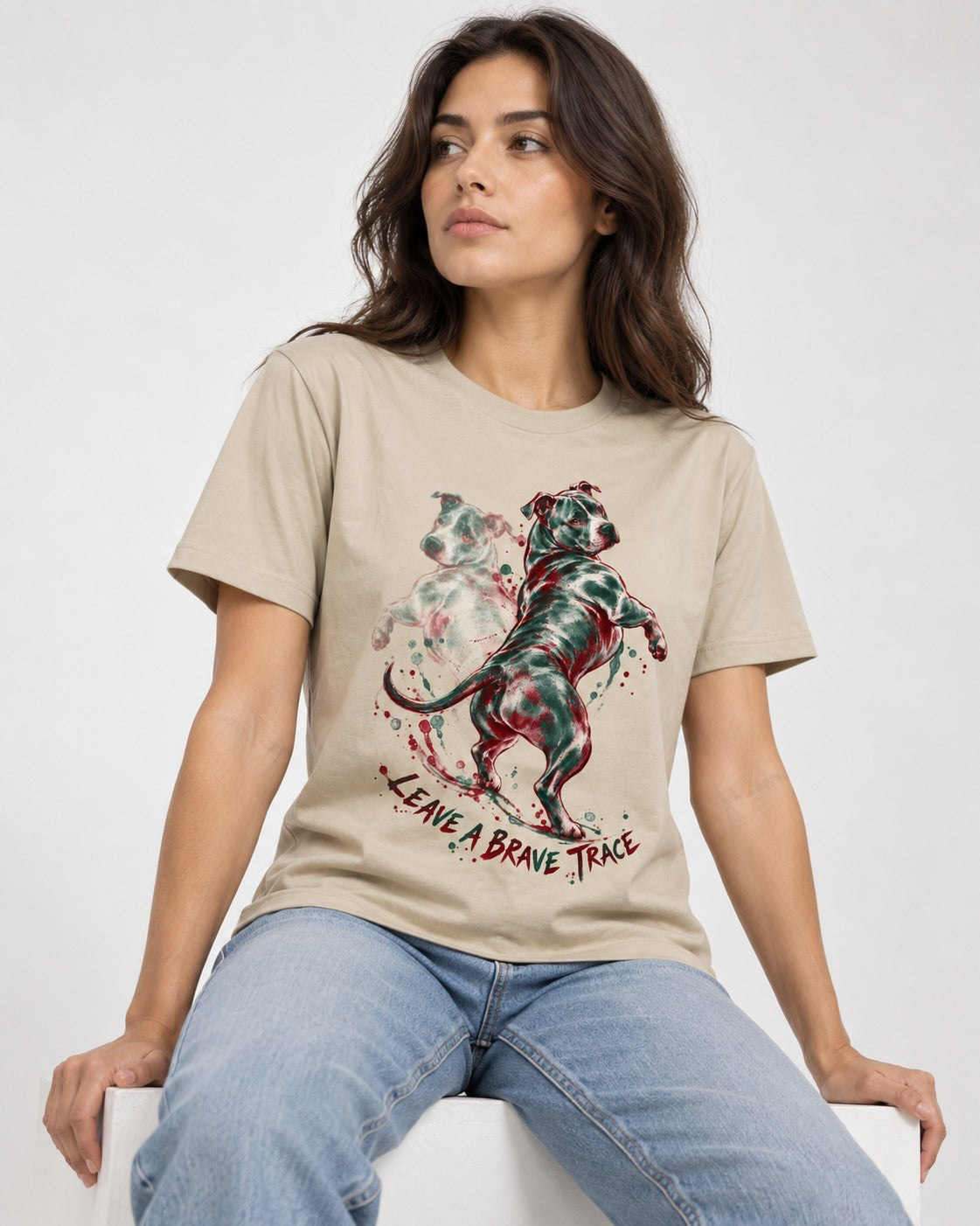 Pitbull's Brave Trace T-Shirt in Sand, worn by a seated model