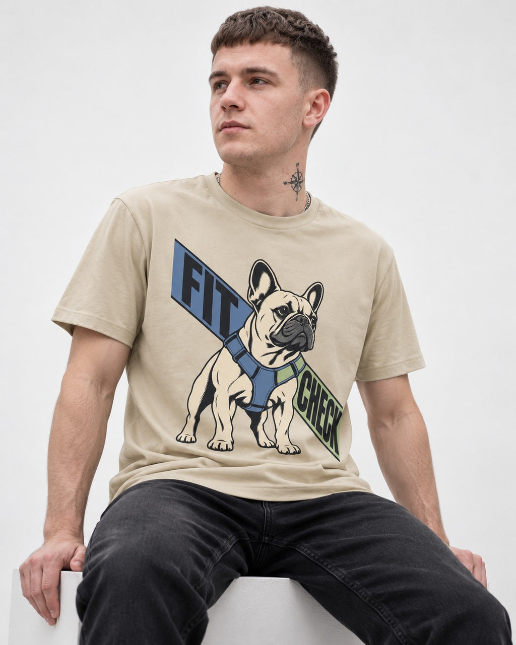 Frenchie Fit Check T-Shirt in Sand, worn by a seated model