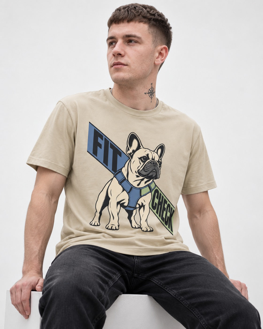 Frenchie Fit Check T-Shirt in Sand, worn by a seated model