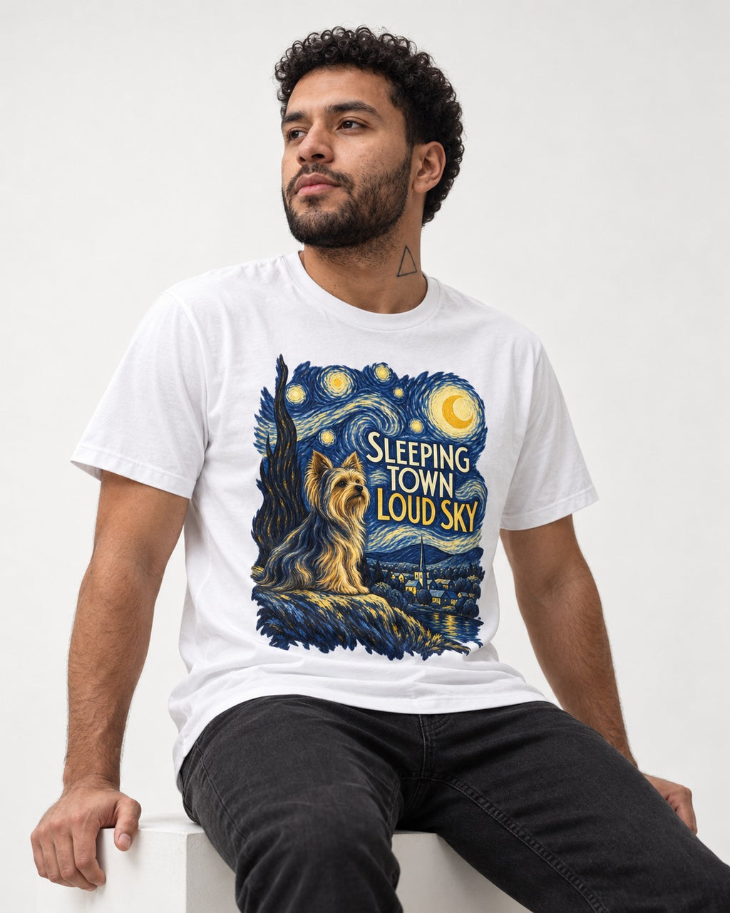 Yorkshire Terrier Sleeping Town Loud Sky Starry Night Graphic T-Shirt in White, worn by a seated model