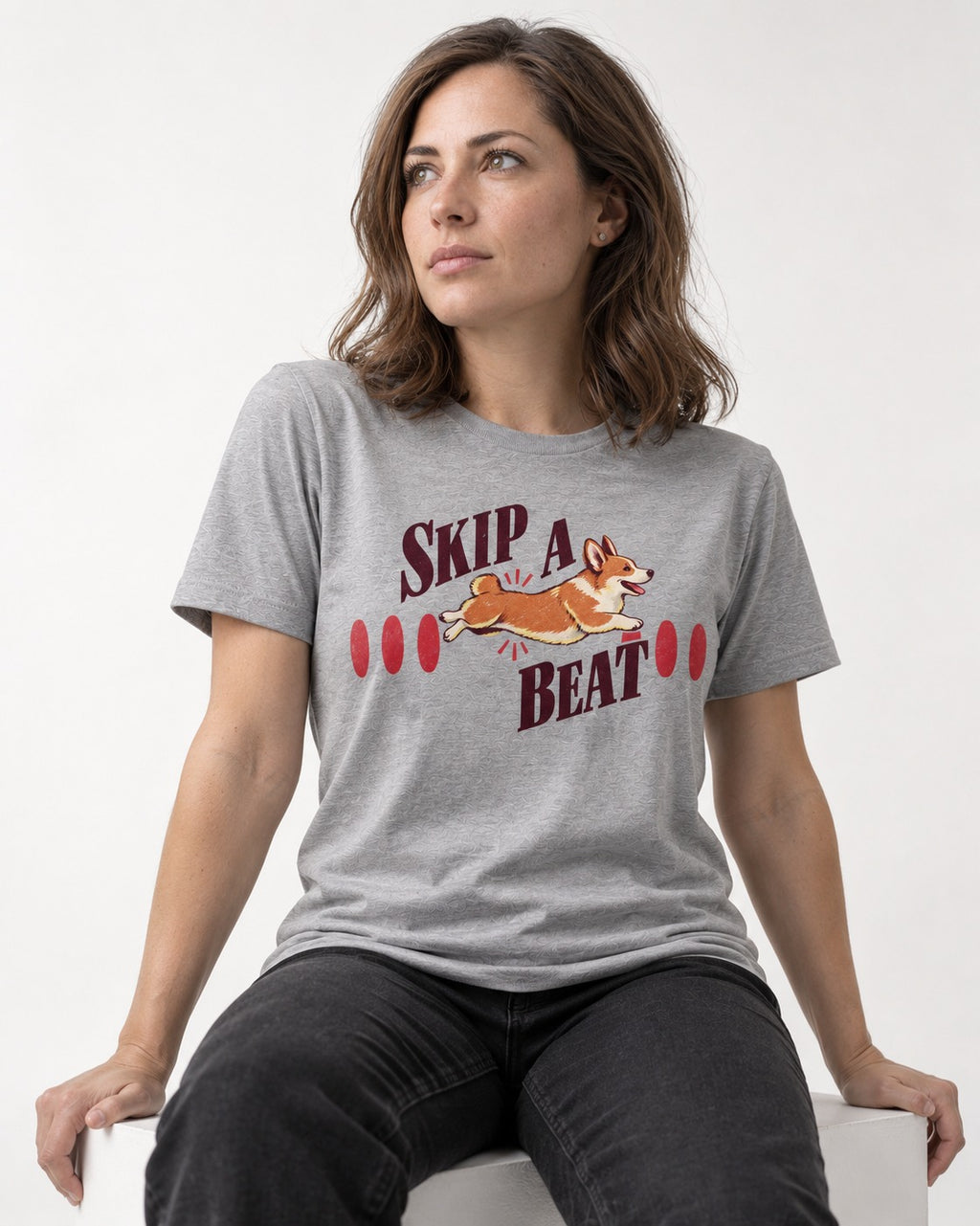 Skip a Beat Corgi T-Shirt in Sport Grey, worn by a seated model
