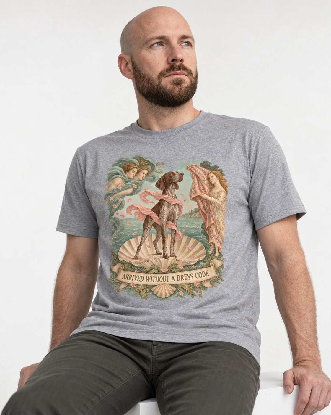 German Shorthaired Pointer Arrived Without A Dress Code Birth Of Venus Graphic T-Shirt in Sport Grey, worn by a seated model