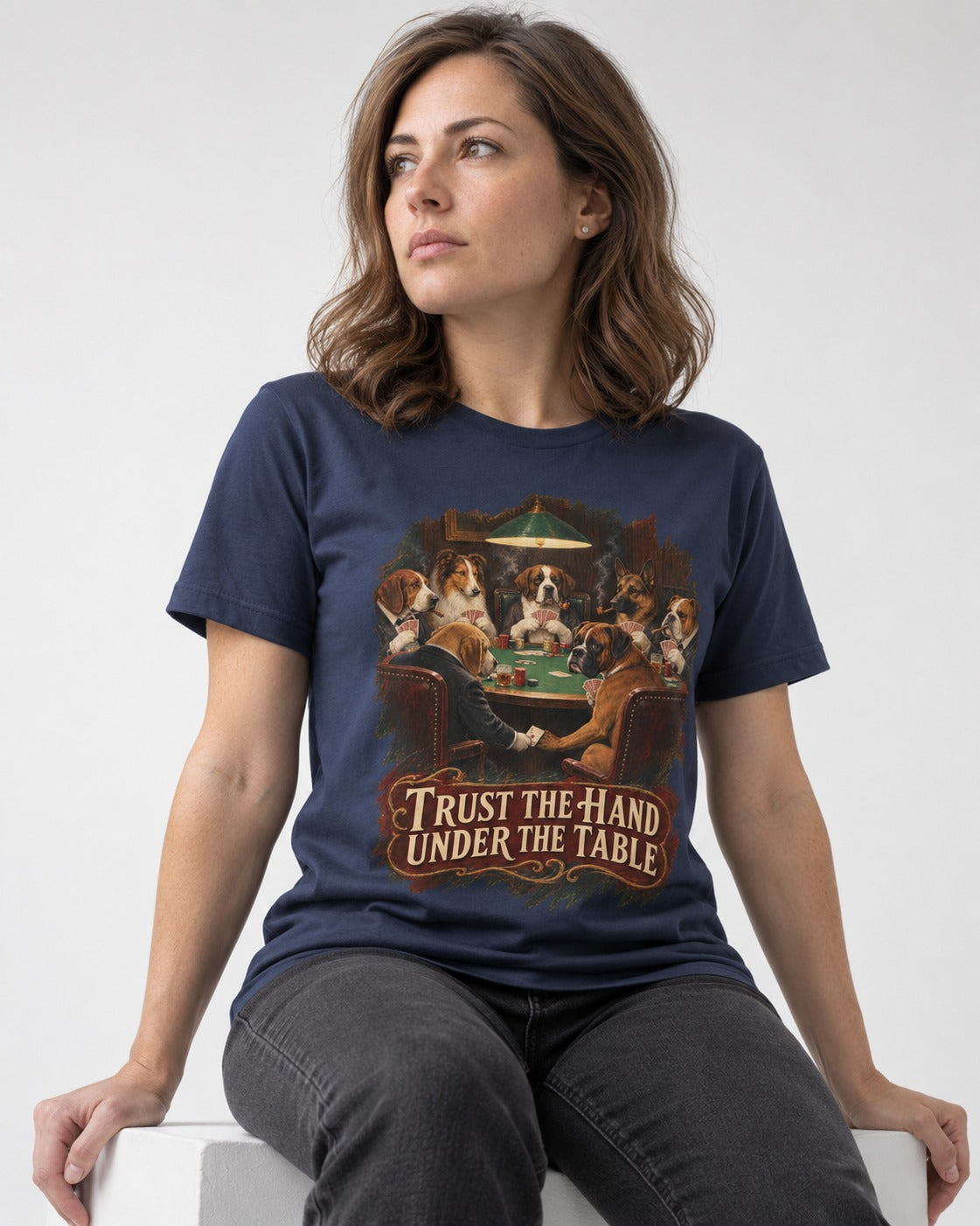 Trust the Hand Under the Table Boxer Poker Graphic T-Shirt in Navy, worn by a seated model