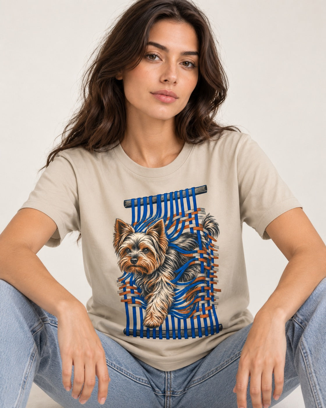Yorkshire Terrier Unbound T-Shirt in Sand, worn by a seated model