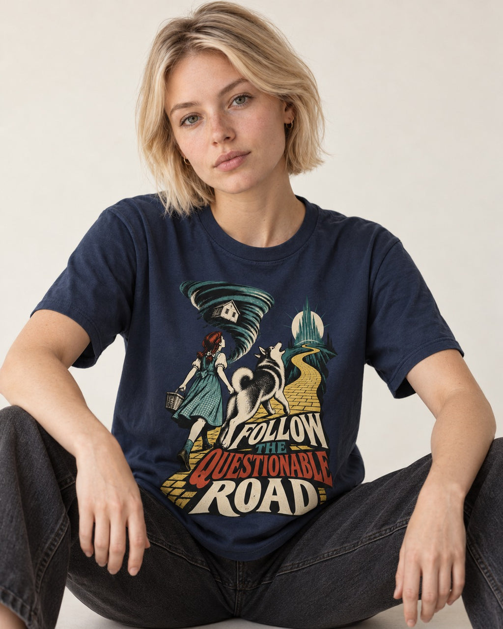 Husky Follow the Questionable Road Tornado Graphic T-Shirt in Navy, worn by a seated model