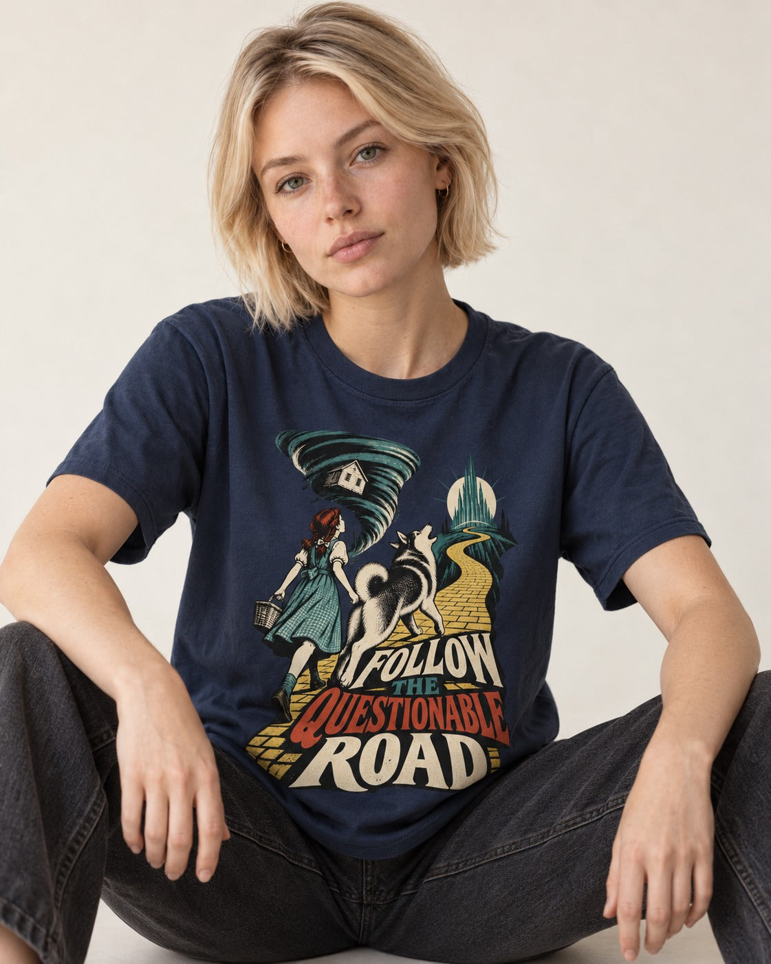 Husky Follow the Questionable Road Tornado Graphic T-Shirt in Navy, worn by a seated model