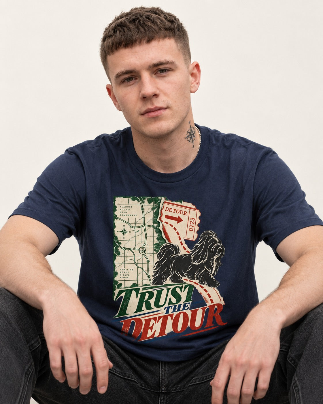 Shih Tzu Trust the Detour Road Map Graphic T-Shirt in Navy, worn by a seated model