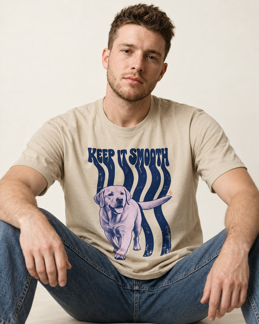 Keep It Smooth Labrador Retriever T-Shirt in Sand, worn by a seated model