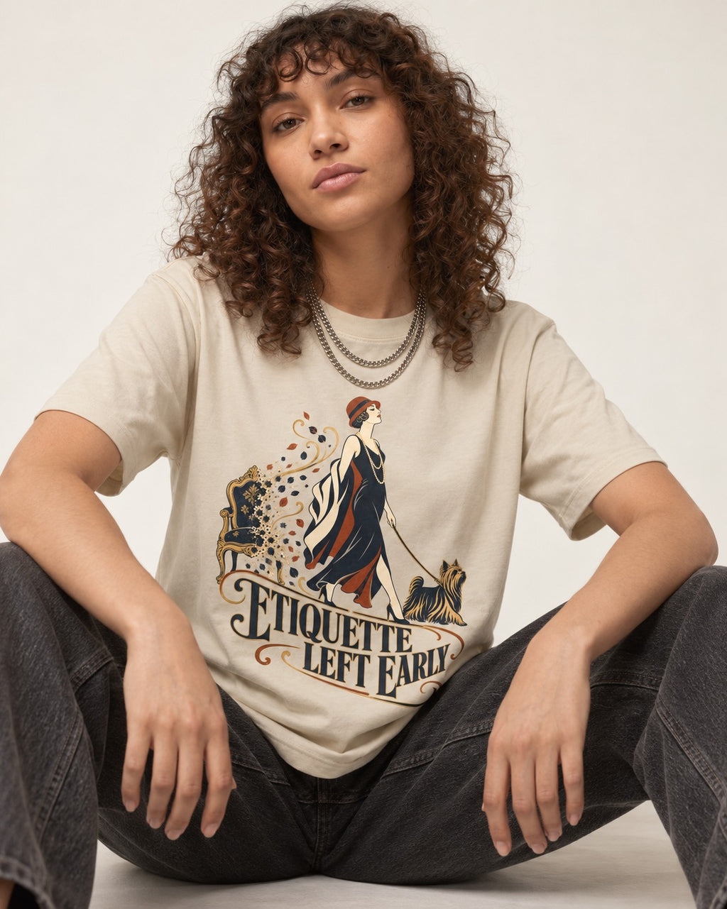Yorkshire Terrier Etiquette Left Early T-Shirt in Sand, worn by a seated model