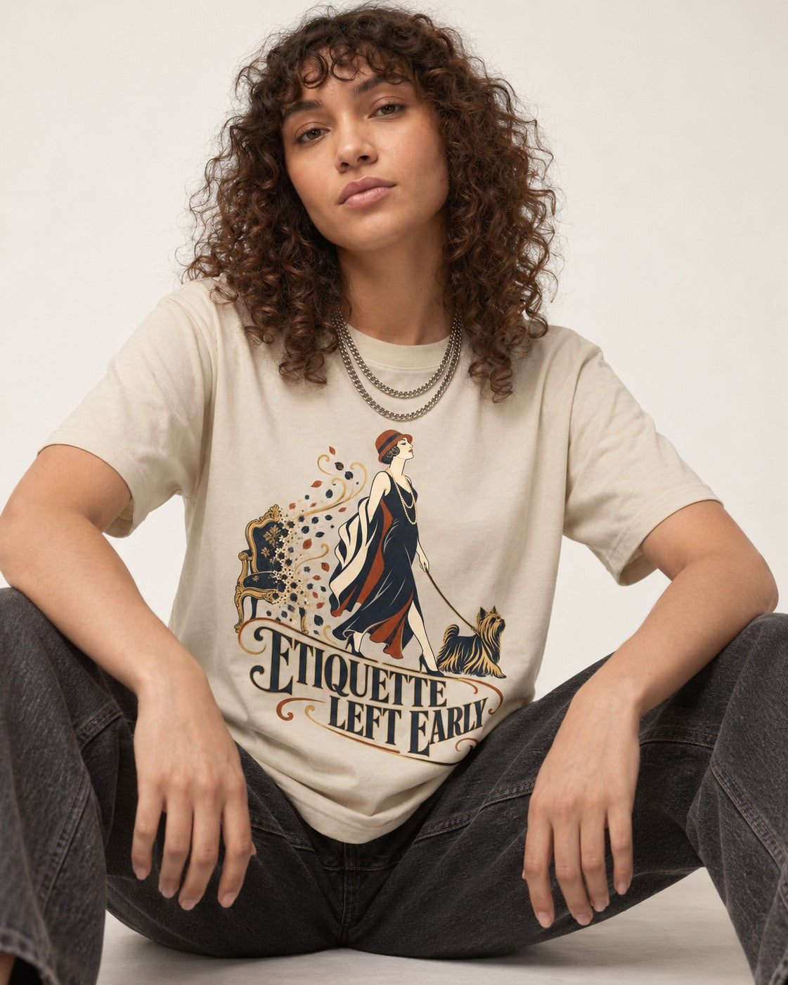 Yorkshire Terrier Etiquette Left Early T-Shirt in Sand, worn by a seated model