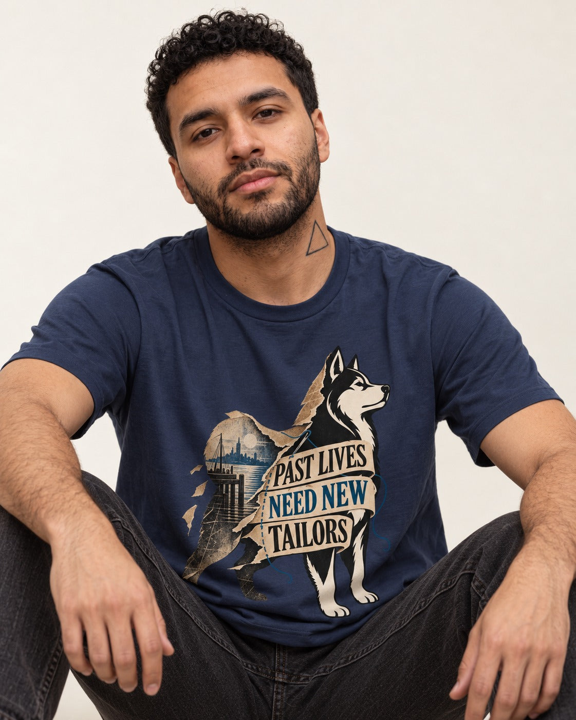 Husky Past Lives Need New Tailors Split Identity Graphic T-Shirt in Navy, worn by a seated model
