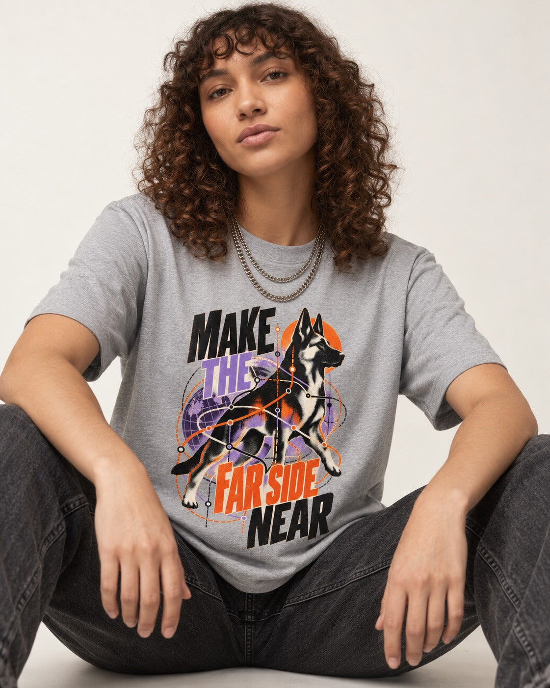 German Shepherd Dog Far Side Near T-Shirt in Sport Grey, worn by a seated model