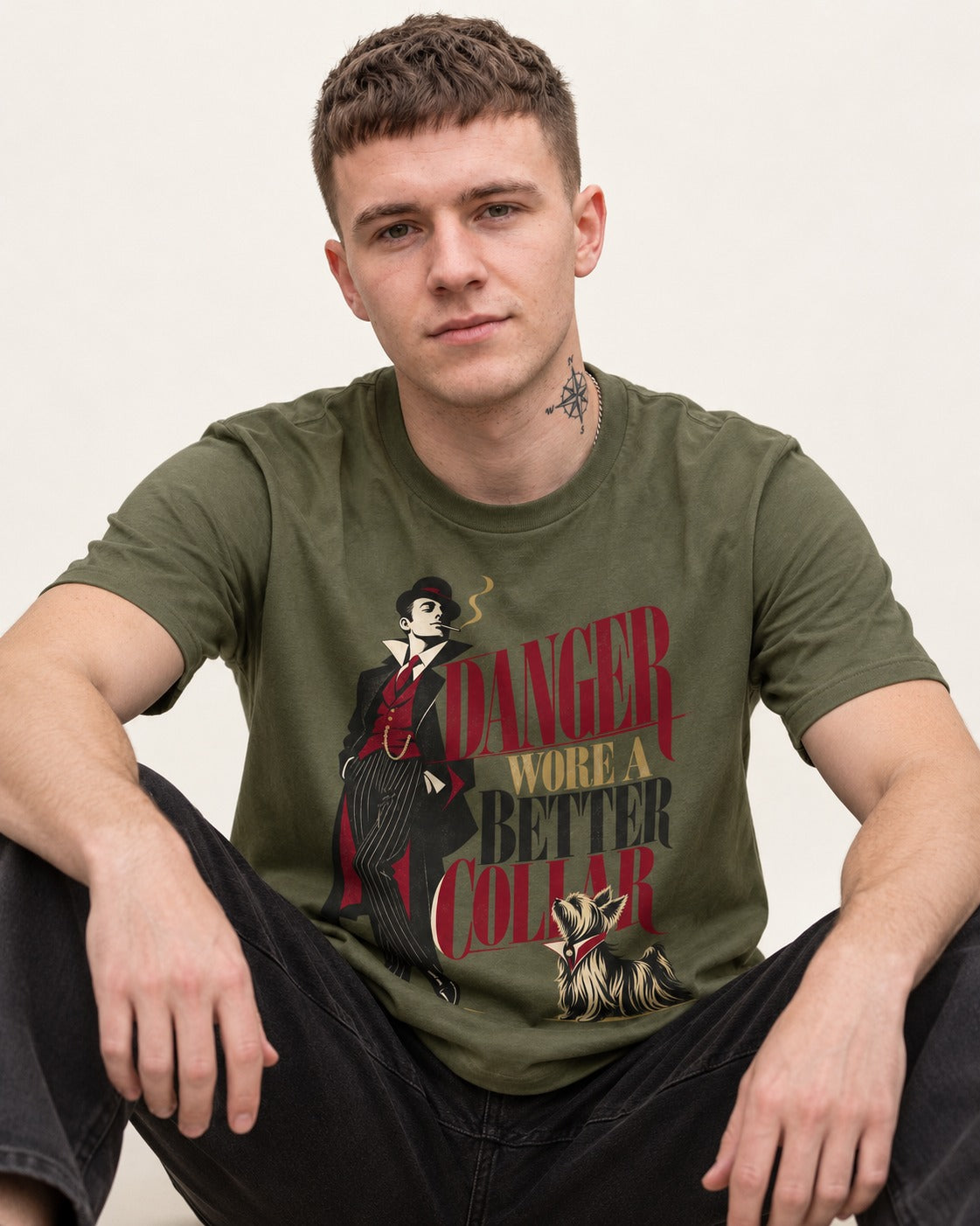 Yorkshire Terrier Danger Wore a Better Collar Art Deco Graphic T-Shirt in Heather Military Green, worn by a seated model