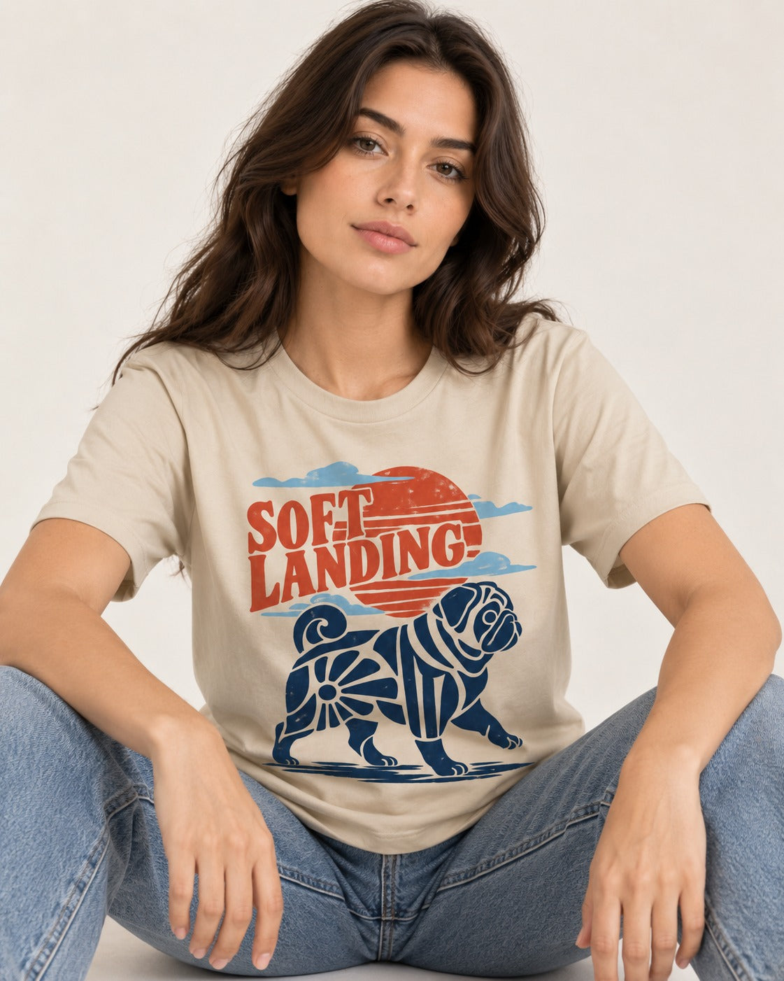 Pug's Soft Landing T-Shirt in Sand, worn by a seated model