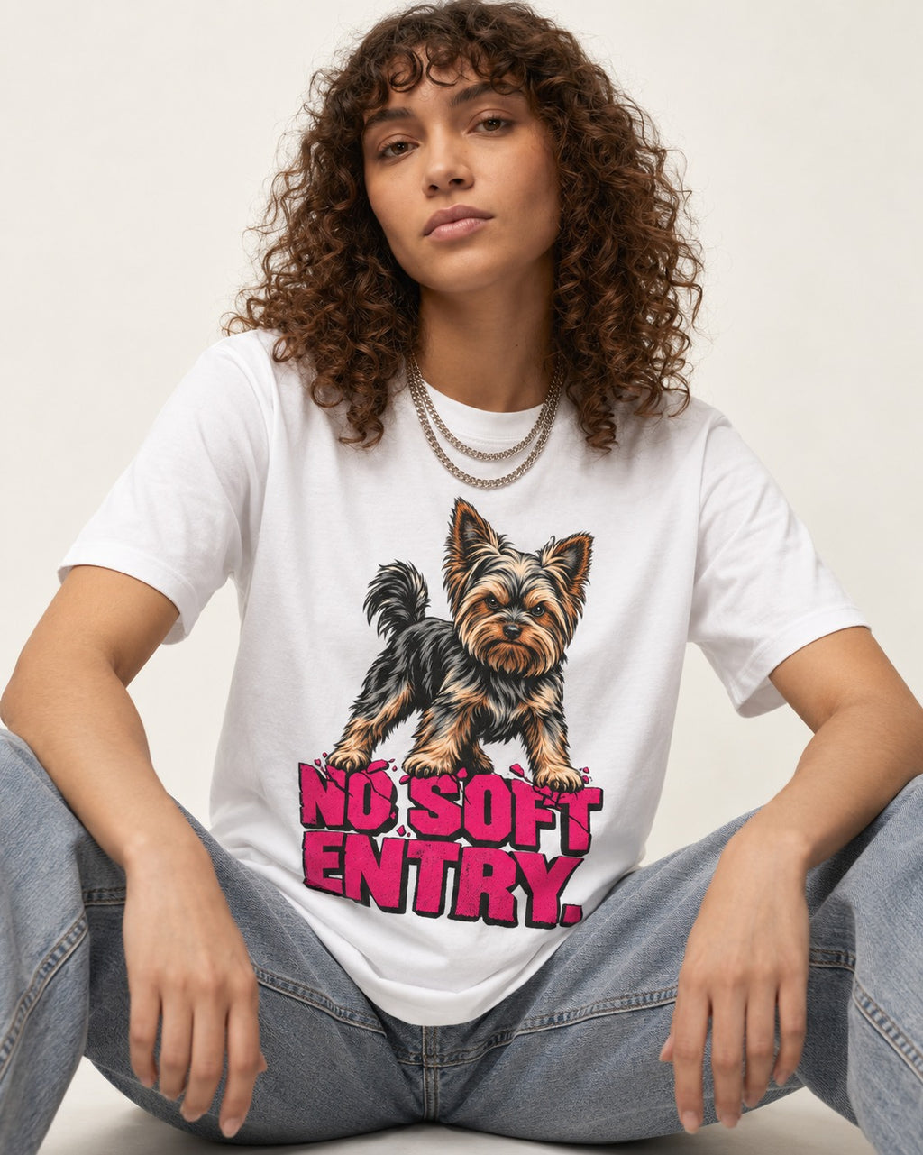 Yorkshire Terrier No Soft Entry Stance Graphic T-Shirt in White, worn by a seated model
