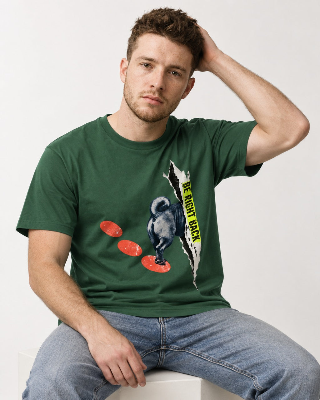Pug Be Right Back Torn Portal Graphic T-Shirt in Forest Green, worn by a seated model