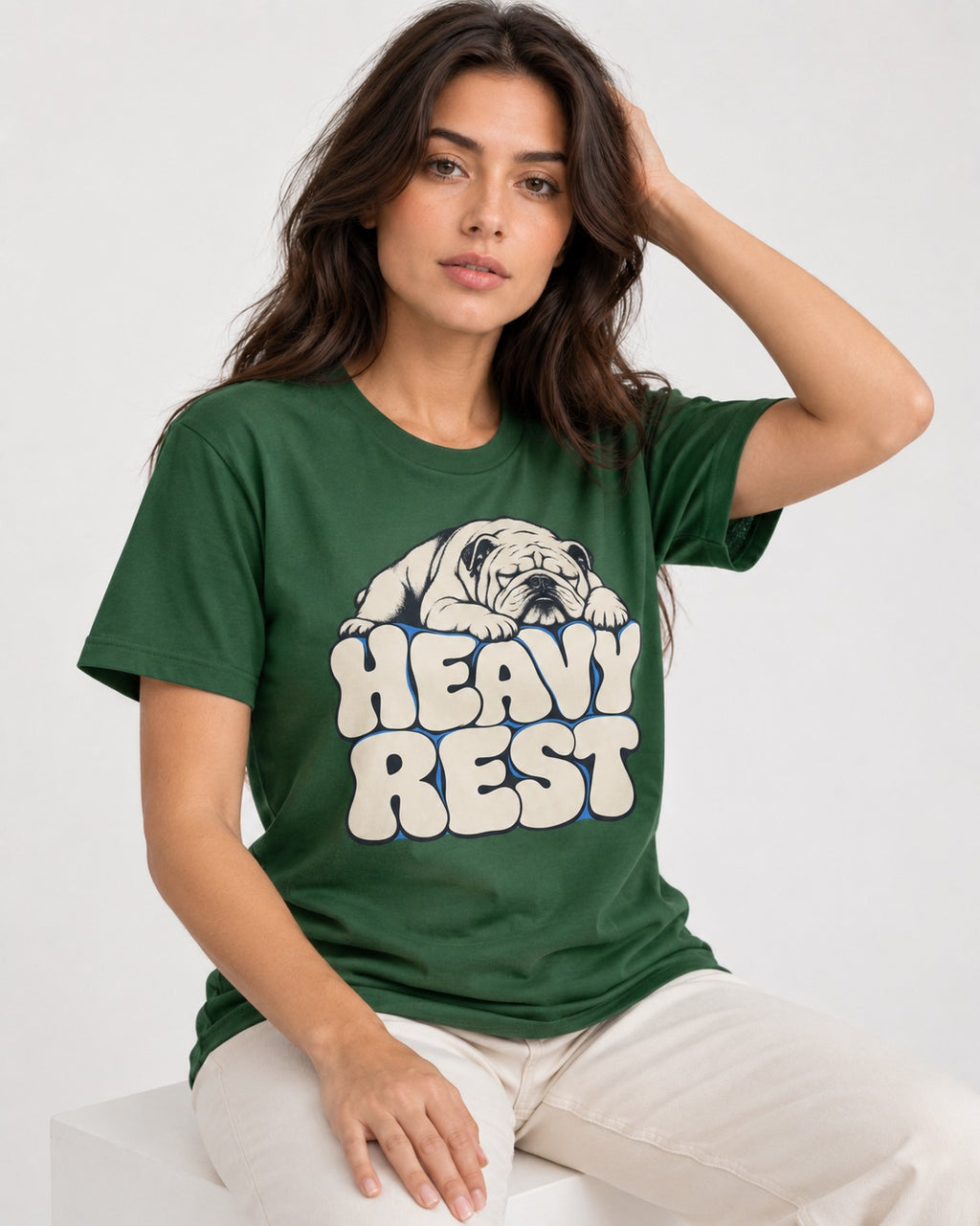 English Bulldog Heavy Rest Graphic T-Shirt in Forest Green, worn by a seated model