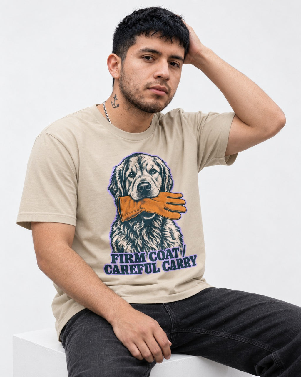 Golden Retriever Firm Coat Careful Carry T-Shirt in Sand, worn by a seated model