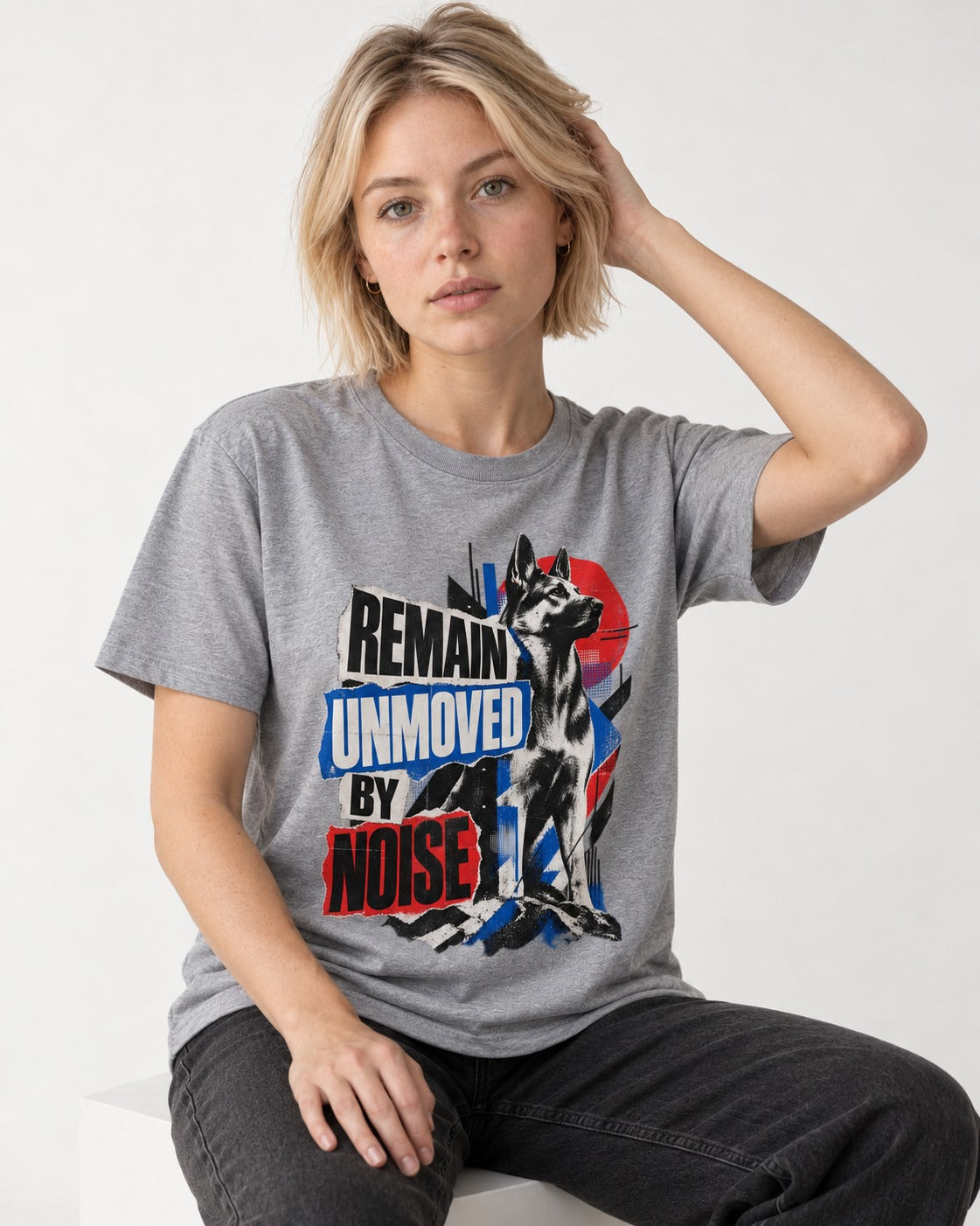 Remain Unmoved By Noise Brutalist Collage German Shepherd Dog Graphic T-Shirt in Sport Grey, worn by a seated model