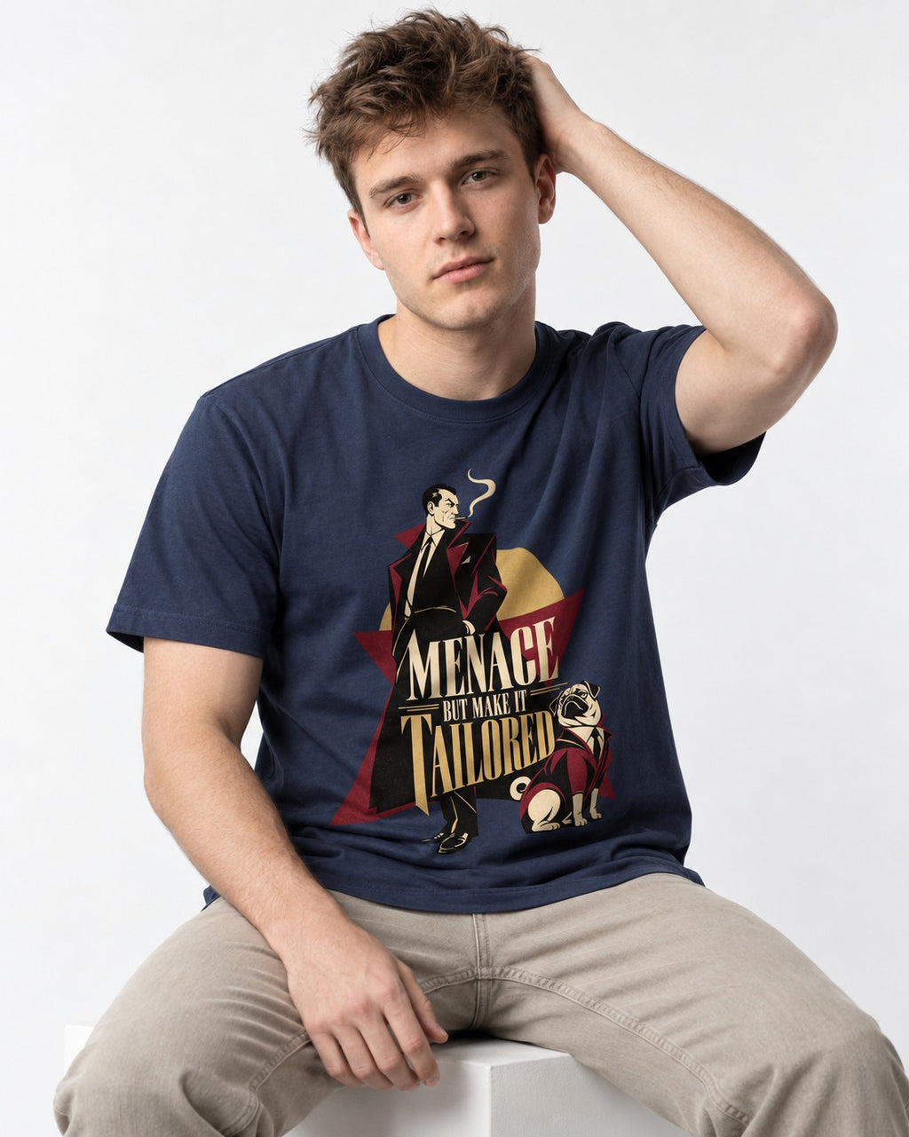 Pug Menace But Make It Tailored Graphic T-Shirt in Navy, worn by a seated model