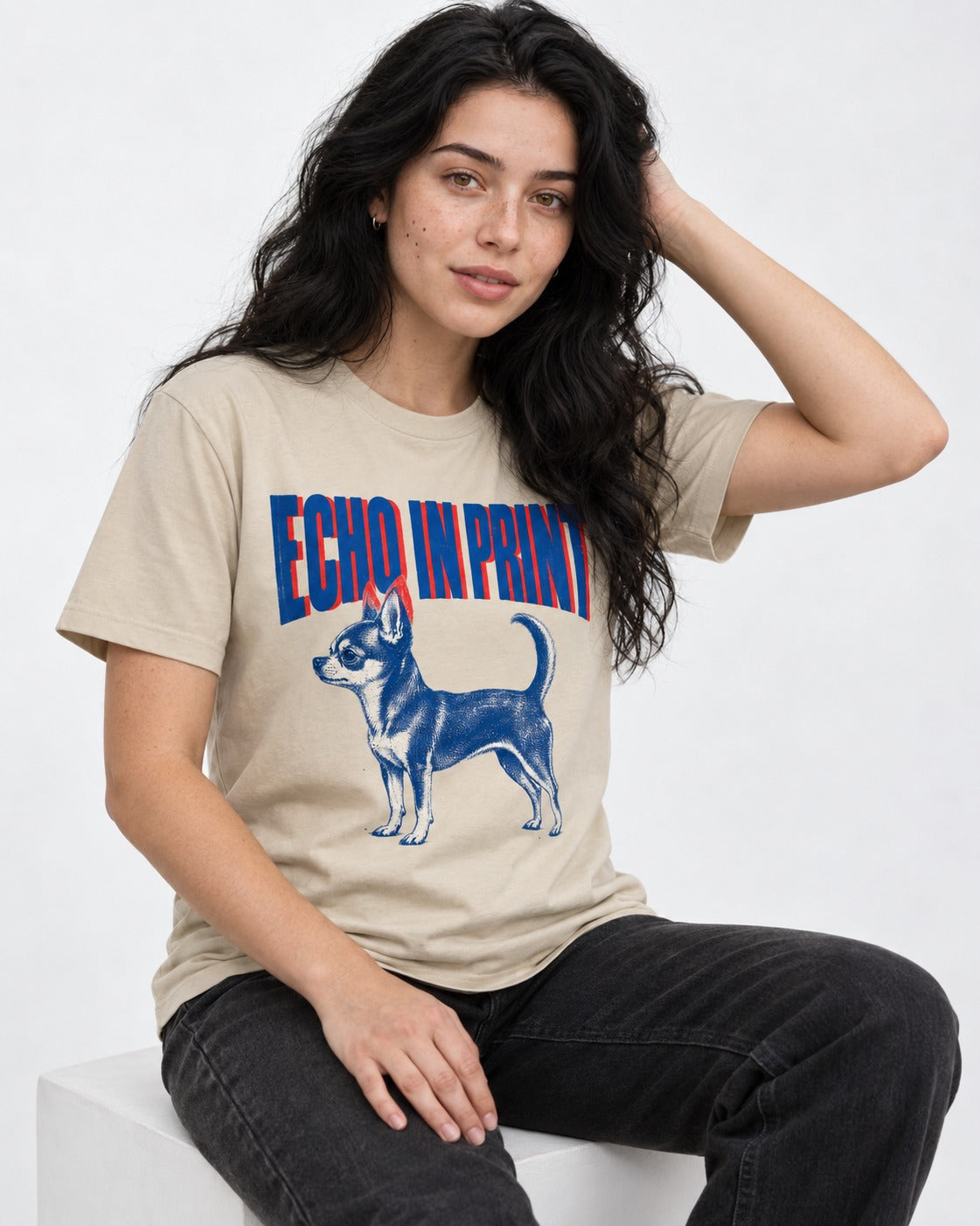 Chihuahua Echo T-Shirt in Sand, worn by a seated model