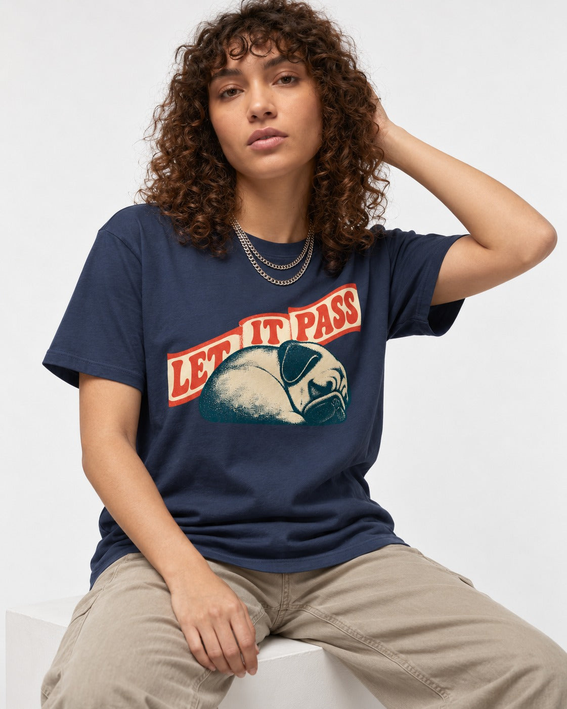 Pug Let It Pass Sleeping Banner Graphic T-Shirt in Navy, worn by a seated model