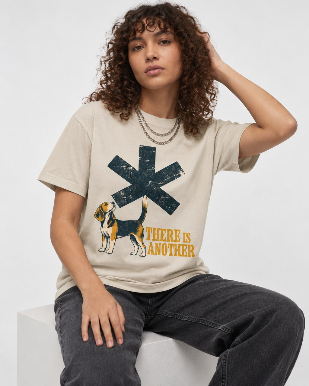 There Is Another Beagle T-Shirt in Sand, worn by a seated model