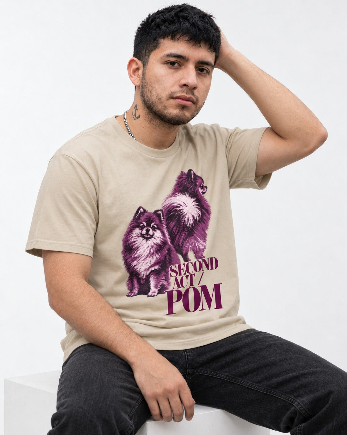 Second Act Pomeranian T-Shirt in Sand, worn by a seated model