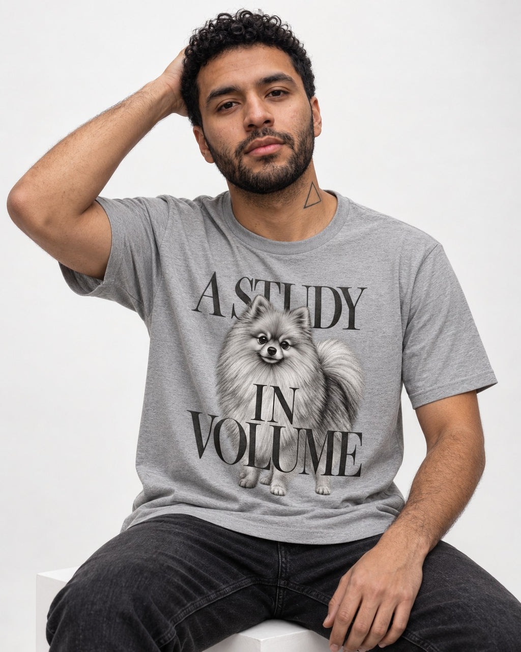 Pomeranian Study in Volume T-Shirt in Sport Grey, worn by a seated model