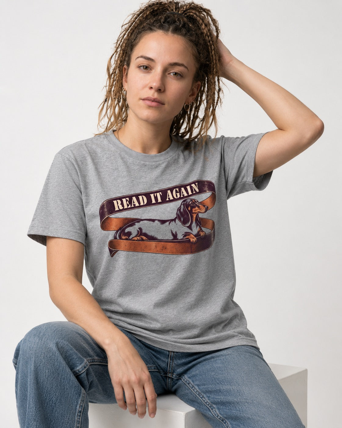 Read It Again Dachshund T-Shirt in Sport Grey, worn by a seated model