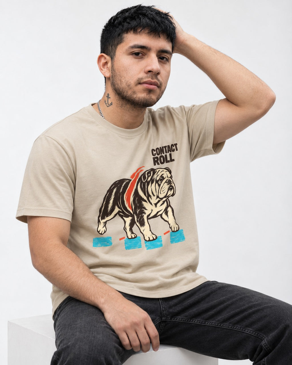 Contact Roll English Bulldog T-Shirt in Sand, worn by a seated model