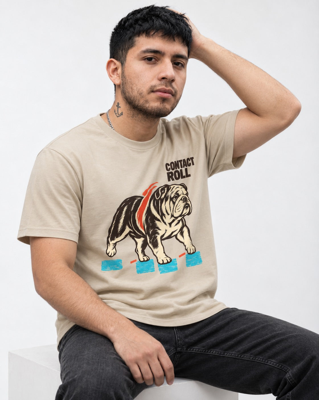 Contact Roll English Bulldog T-Shirt in Sand, worn by a seated model