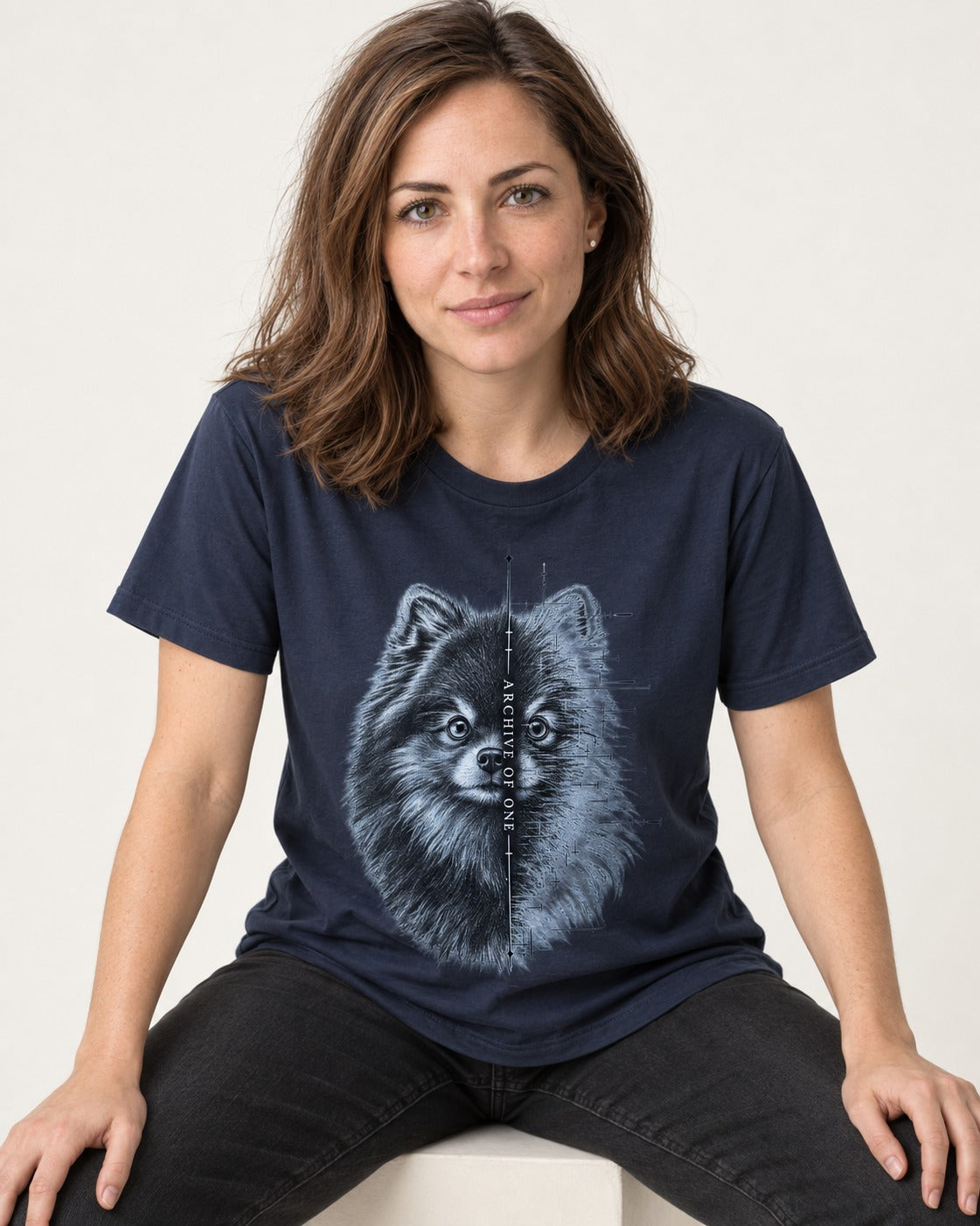 Pomeranian Archive of One Split Portrait Graphic T-Shirt in Navy, worn by a seated model