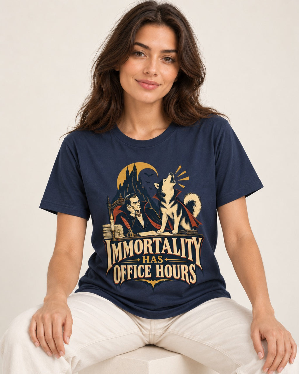 Husky Immortality Has Office Hours Vampire Office Graphic T-Shirt in Navy, worn by a seated model