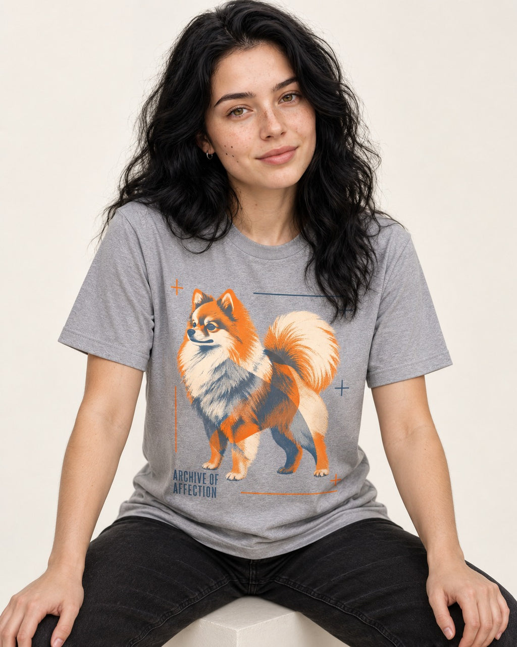 Pomeranian Archive of Affection T-Shirt in Sport Grey, worn by a seated model