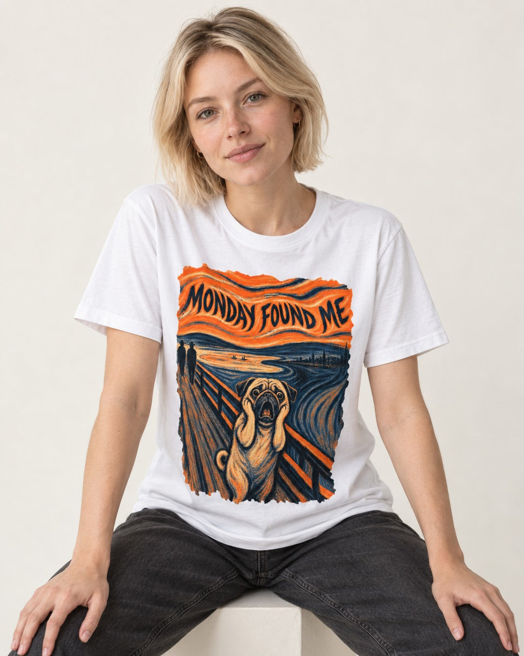 Pug Monday Found Me Scream Parody Graphic T-Shirt in White, worn by a seated model