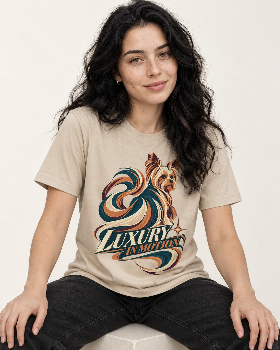 Yorkshire Terrier Luxury in Motion T-Shirt in Sand, worn by a seated model
