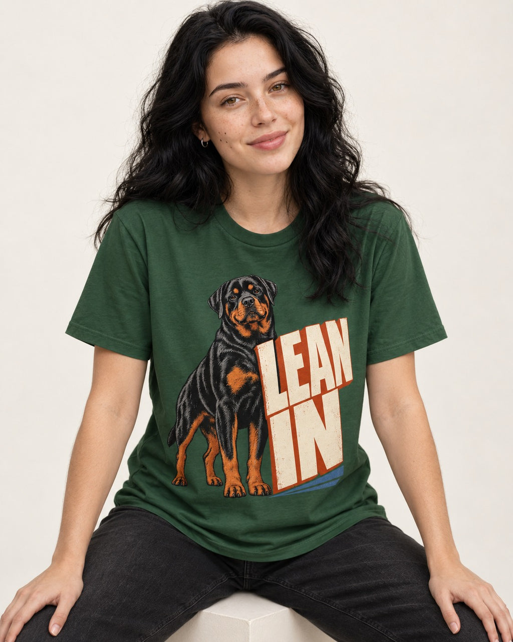 Rottweiler Lean In Block Typography Graphic T-Shirt in Forest Green, worn by a seated model