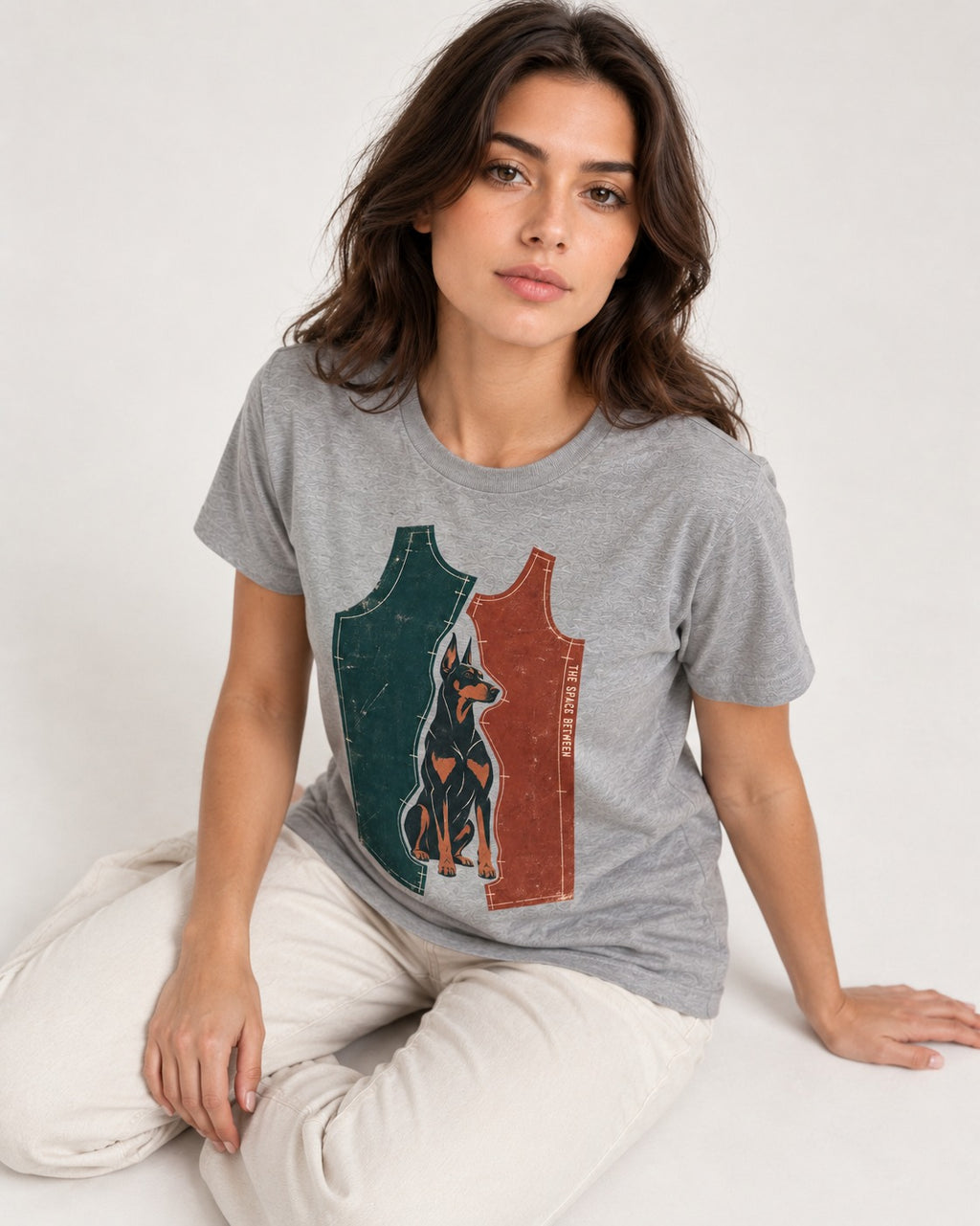 Doberman The Space Between Pattern Pieces Graphic T-Shirt in Sport Grey, worn by a seated model