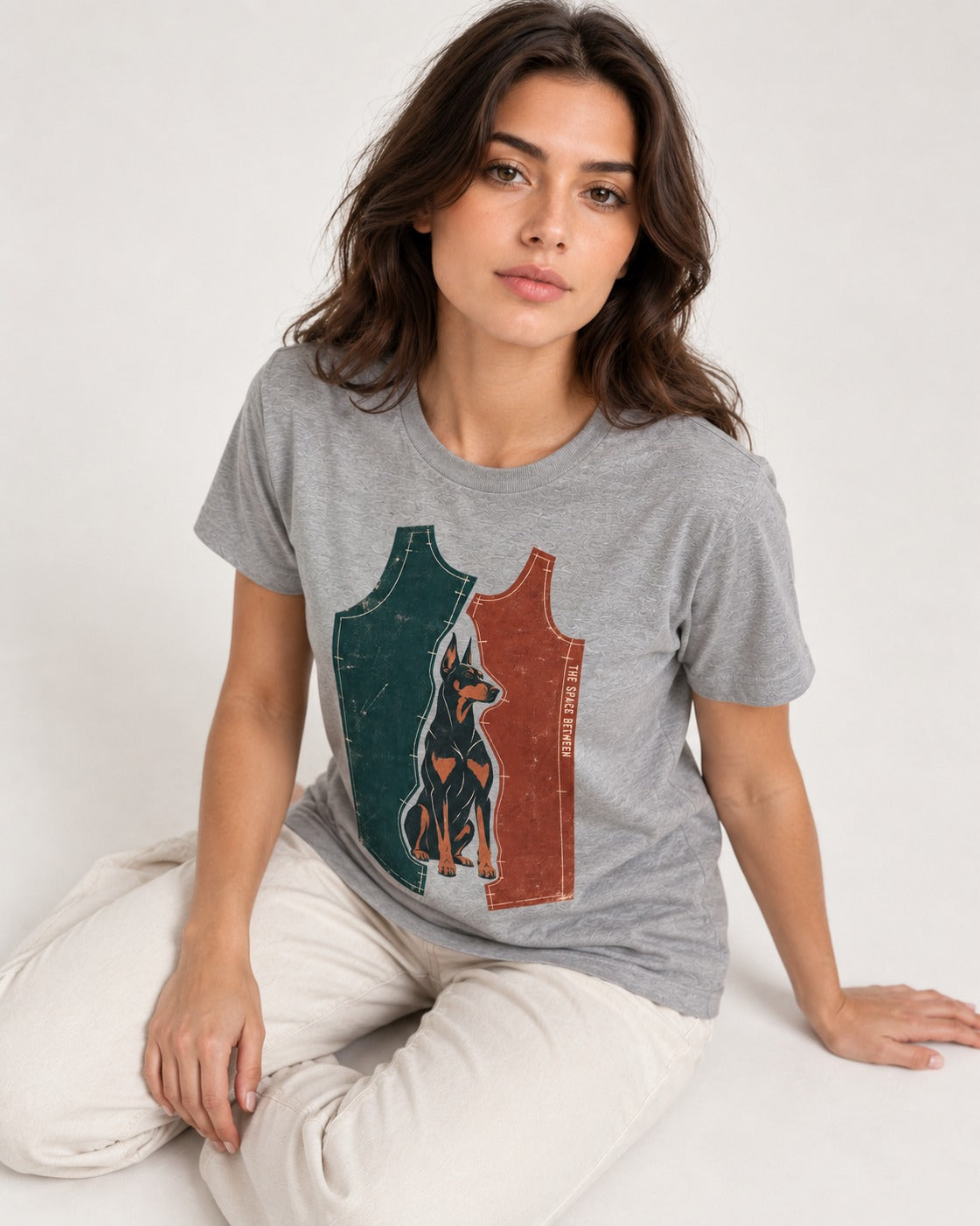 Doberman The Space Between Pattern Pieces Graphic T-Shirt in Sport Grey, worn by a seated model
